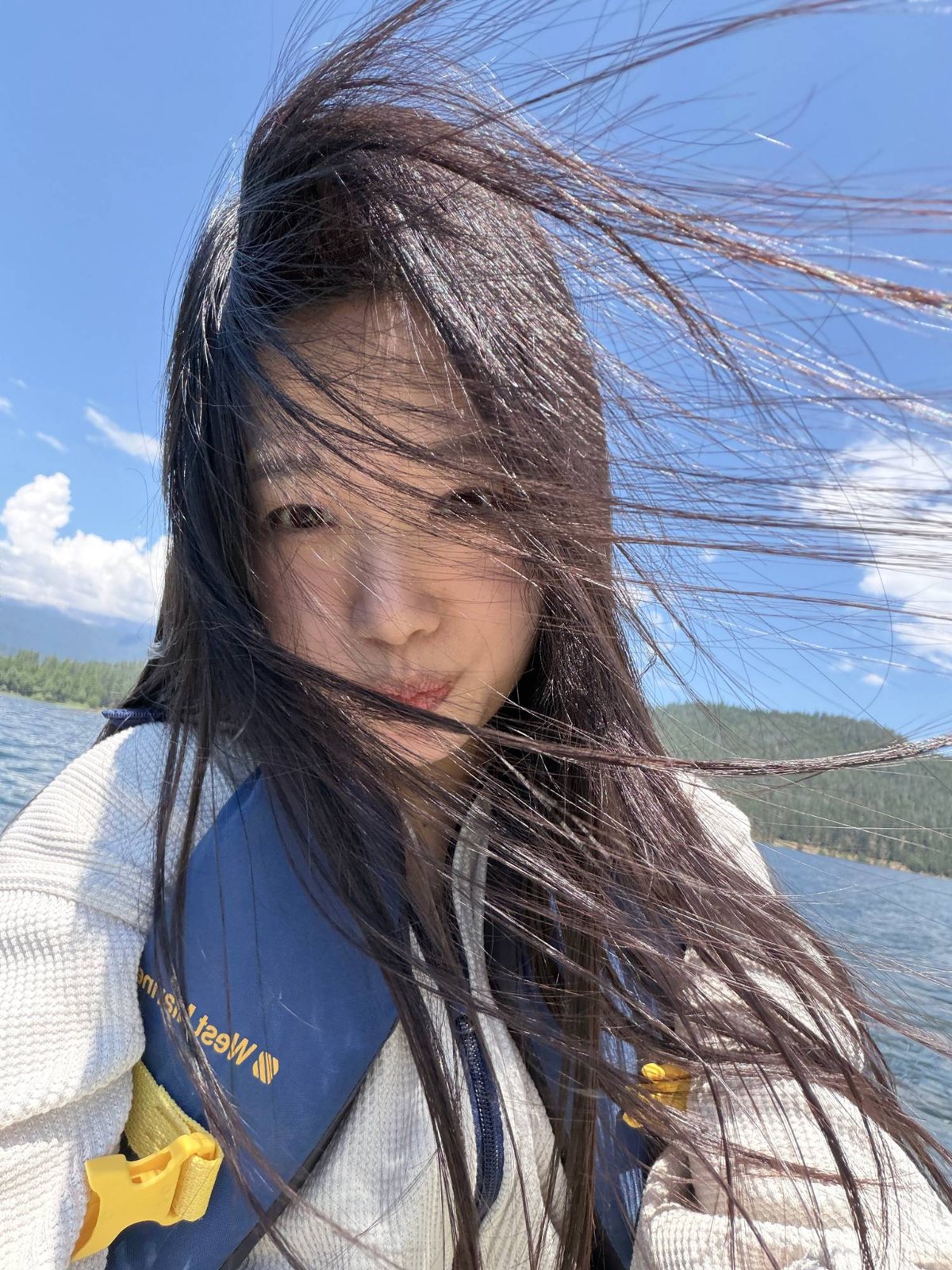 Wenxin on a windy lake, hair blowing